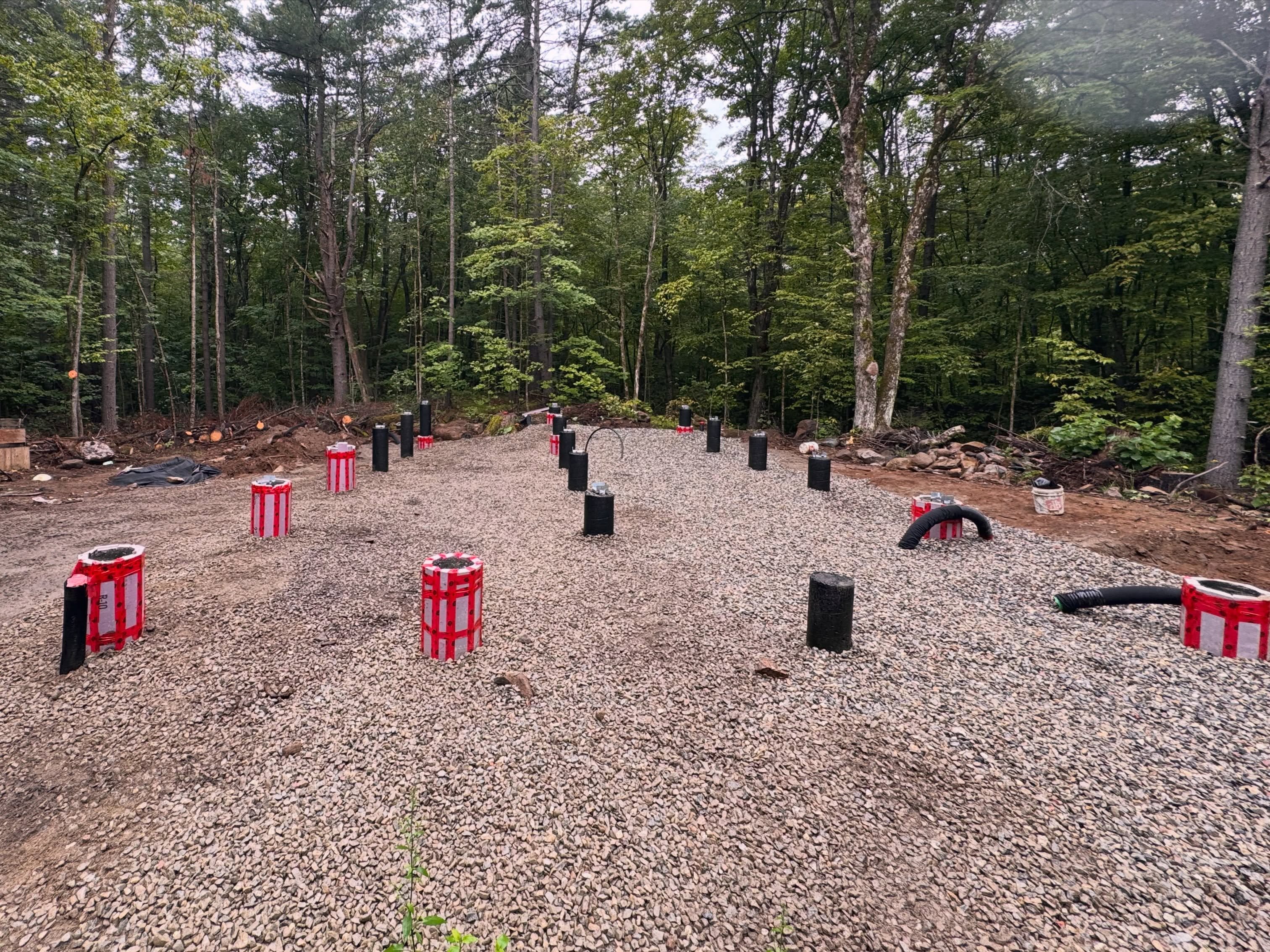 After a few months, the foundation is done. With a final layer of geotextile fabric and gravel, we’ve sealed in and protected the base. Next…