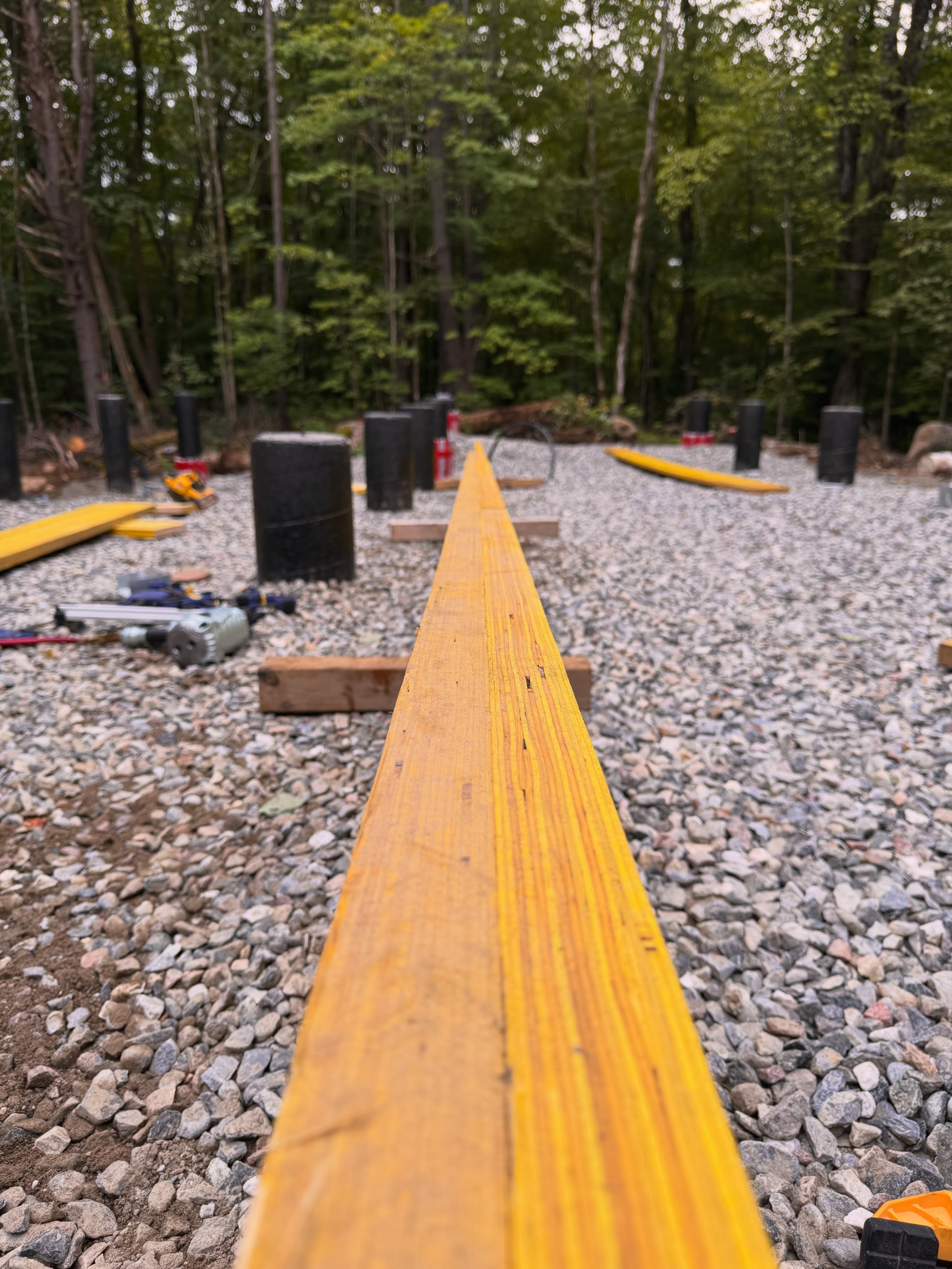 Half way through laminating our centre beam. This laminated LVL beam will hold the house’s weight