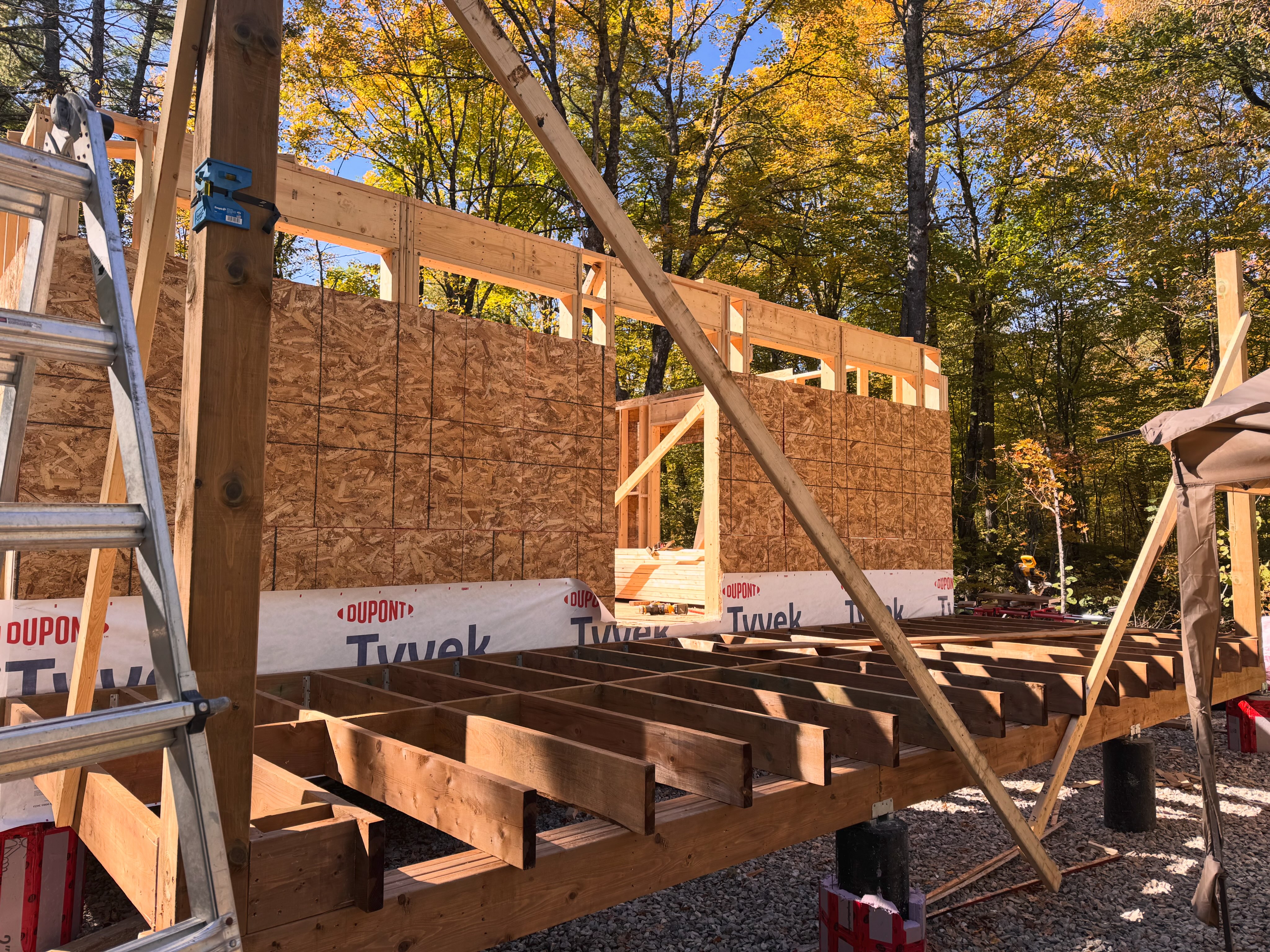 Exterior sheathing and the front porch framing has been built. Up next we’ll finish the deck and build the interior walls to making raising…
