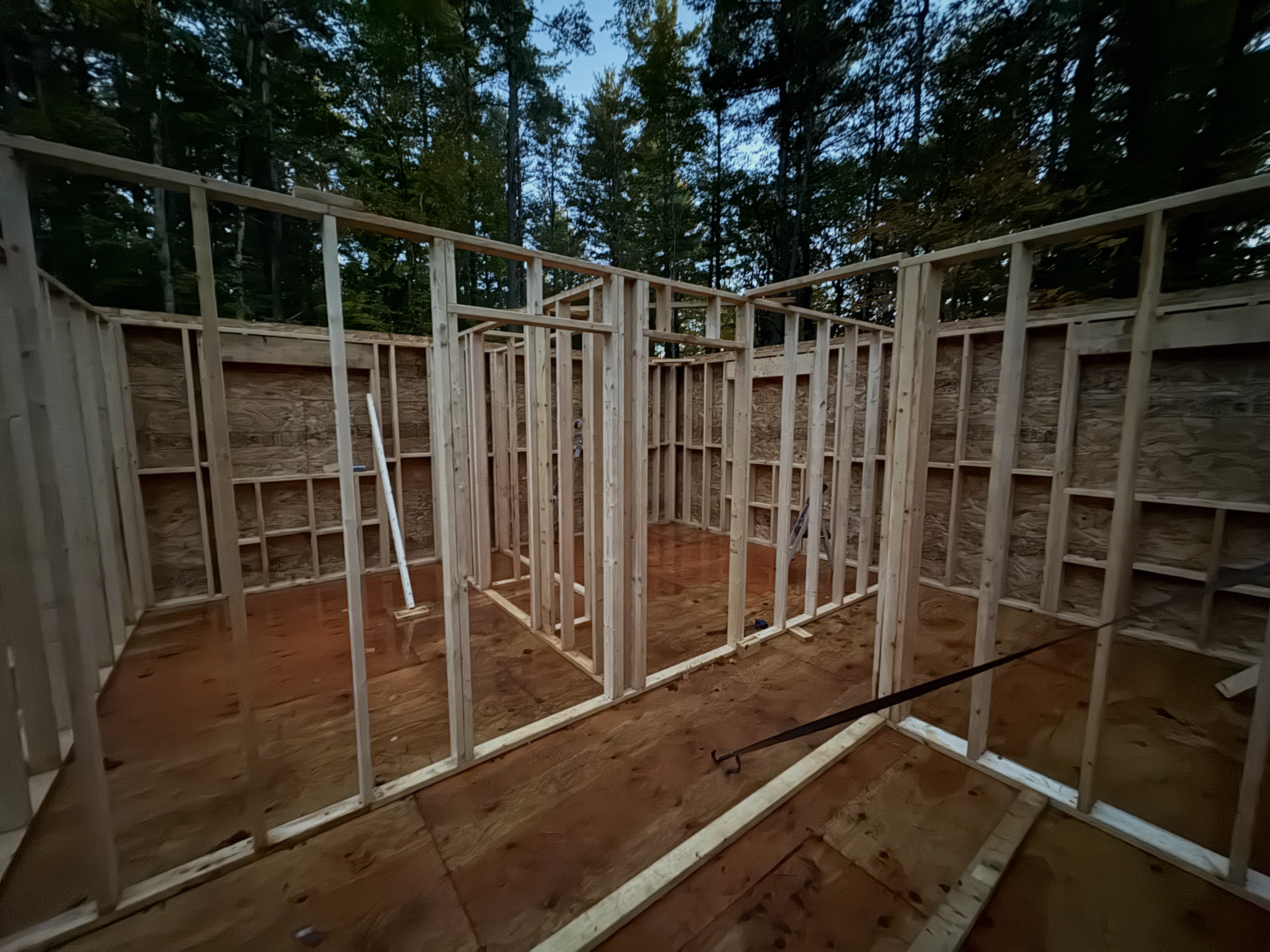 The interior walls have risen! Captured after a hard day’s work, these walls will see sound proofing and a mix of wood and drywall in the co…